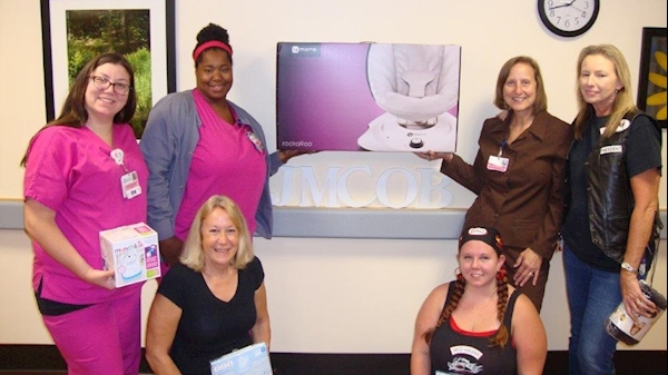 The West Virginia Chapter of Bikers Against Heroin recently donated items to the OB department at WVU Medicine Jefferson Medical Center to help care for babies with neonatal abstinence syndrome.  Pictured from left to right: (standing) Tiffany D’Autrechy, Tasheema Bullock, Kellie Minney, Dee Pierce, (kneeling) Tina Renner and Gabriella Churchman.